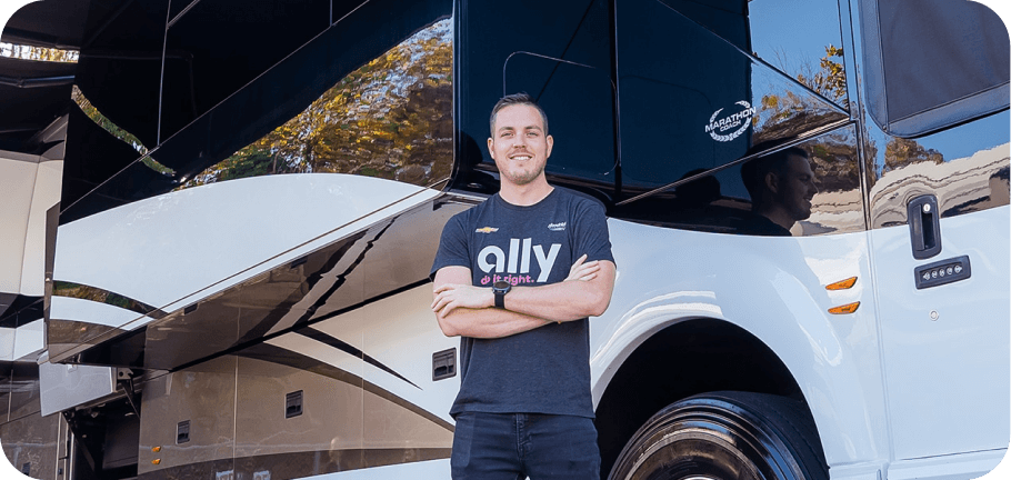 Alex Bowman stands outside of his Prevost tour bus.