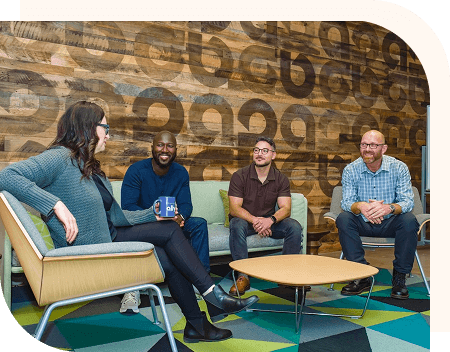 A group of Ally employees happily conversing